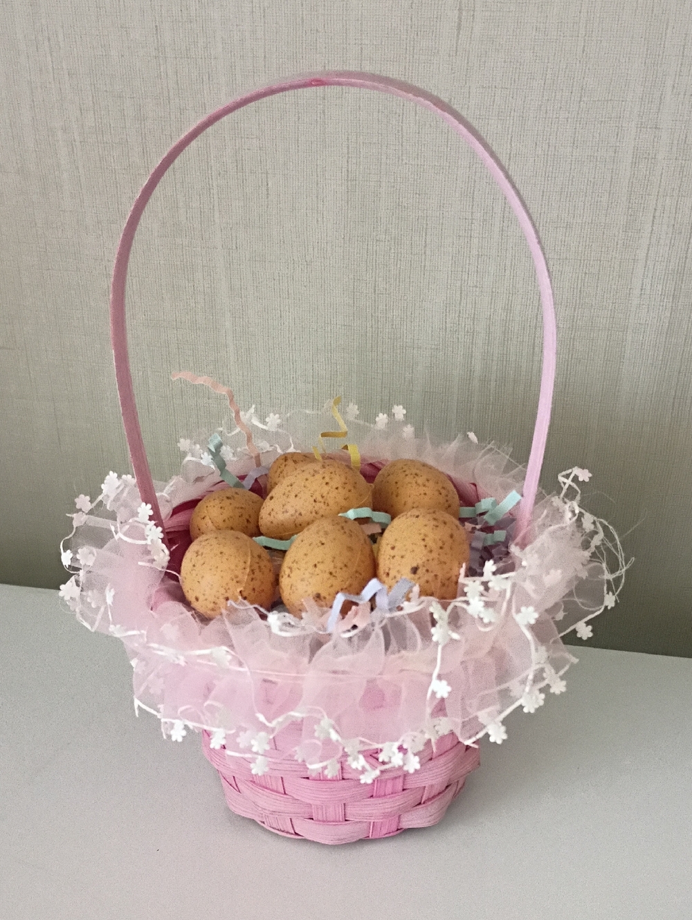Woven Pink Easter Egg Basket With Speckled Brown Eggs Decor